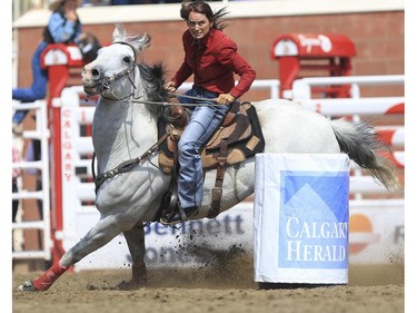 Julie Leggett's got determination in her eyes as she rounds the last barrell during Day 9 of barrel racing action at the 2015 Calgary Stampede, on July 11, 2015.