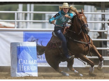 Sydney Daines races around barrel three for the quickest time during Day 9 of barrel racing action at the 2015 Calgary Stampede, on July 11, 2015.