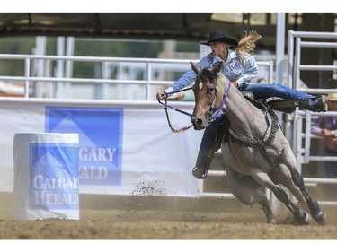 Sarah Rose McDonald takes a wide first turn but still manages the second quickest time during Day 9 of barrel racing action at the 2015 Calgary Stampede, on July 11, 2015.