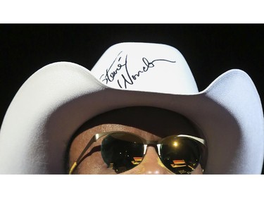 Stevie Wonder wears a white cowboy hat that he signed during last Saddledome concert performance of the 2015 Calgary Stampede in Calgary, on July 12, 2015. Wonder tossed the signed hat out to the crowd.