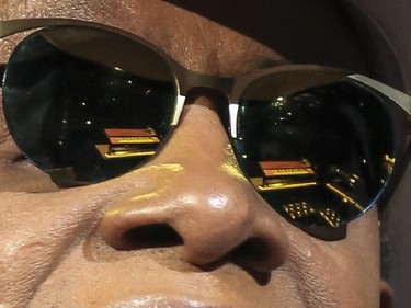 Stevie Wonder's keyboard and piano are reflected in his sunglasses as he walks up to play them during the last Saddledome concert performance of the 2015 Calgary Stampede in Calgary, on July 12, 2015.