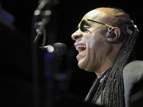 Stevie Wonder belts out a tune as he plays the keyboards during the last Saddledome concert performance of the 2015 Calgary Stampede in Calgary, on July 12, 2015.