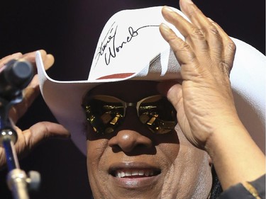 Stevie Wonder wears a white cowboy hat that he signed during last Saddledome concert performance of the 2015 Calgary Stampede in Calgary, on July 12, 2015. Wonder tossed the signed hat out to the crowd.