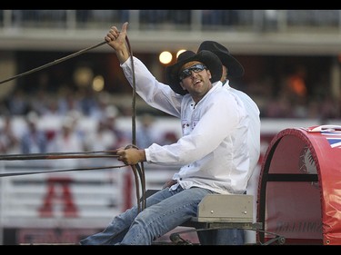 Kurt Bensmiller celebrates his victory in the 2015 Calgary Stampede GMC Rangeland Derby's Chuckwagon Races at the Stampede Grandstand in Calgary on Sunday, July 12, 2015.