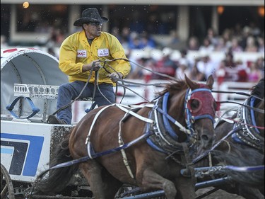 Doug Irvine races during heat two, night ten, of the 2015 Calgary Stampede GMC Rangeland Derby's Chuckwagon Racing at the Stampede Grandstand in Calgary on Sunday, July 12, 2015.