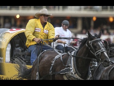 Kirk Sutherland edges out a win during heat eight, night ten, of the 2015 Calgary Stampede GMC Rangeland Derby's Chuckwagon Racing at the Stampede Grandstand in Calgary on Sunday, July 12, 2015.