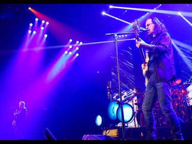 Alex Lifeson, left, Neil Peart, and Geddy Lee entertain Rush fans at the Scotiabank Saddledome in Calgary on Wednesday, July 15, 2015.