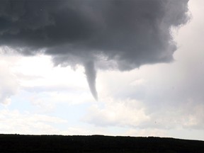 A funnel cloud south of Discovery Ridge is pictured in this July 2015 file photo.