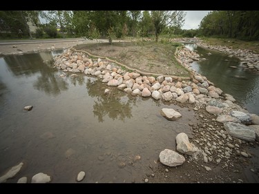 An inlet off the Bow River will allow for Calgarians to walk safely in the waters during the summer, and depending on ice conditions in the water, skate, on St. Patrick's Island in Calgary on Wednesday, July 29, 2015.