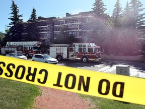 The scene of a fire in an apartment block on 42nd Street NW was taped off as fire investigators tried to gather more information about it on July 29, 2015. One person was transported to hospital with injuries.