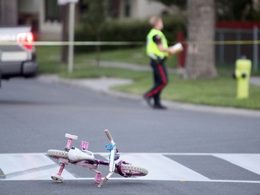 Members of the Calgary Police Service were on the scene investigating after a woman and 2 children struck while crossing Temple Drive at 56th Street NE just after 8 pm on July 29, 2015.