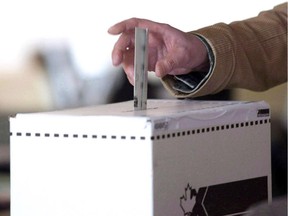 A man casts his vote for the 2011 federal election in Toronto in this May 2, 2011 photo.