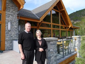 Paul and Adele McIntyre in front of the new clubhouse at Greywolf Golf Course at Panorama, B.C.