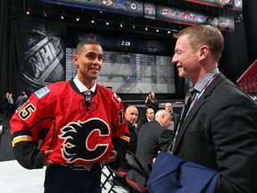 Swedish defenceman Oliver Kylington, seen speaking with Calgary Flames' vice president of communications Peter Hanlon at the 2015 NHL Entry Draft in Sunrise, Fla. last month. Flames fans will get a look at him during the team's development camp this week.