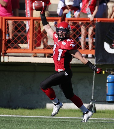 Calgary Stampeders Adam Thibault celebrates the recovery of a block kick against the  Winnipeg Blue Bombers during their game at McMahon Stadium on July 18, 2015.