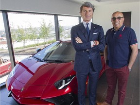 Lamborghini president and chief executive Stephan Winkelmann, left, and Calgary dealer Asgar Virji  stand beside a Aventador Superveloce Thursday July 2, 2015 at the company's fourth Canadian dealership.