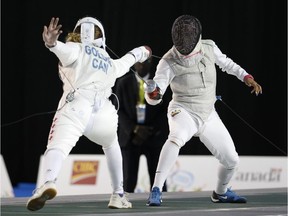 Calgary's Alanna Goldie, left, competes against Colombia's Saskia Loretta Van Erven Garcia in a women's foil individual semifinal fencing match at the Pan Am Games on Wednesday. She lost the match but won the bronze medal.