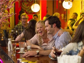 This photo provided by Universal Pictures shows, Amy Schumer , left, as Amy, and Bill Hader as Aaron, on a date in "Trainwreck," the new comedy from director/producer Judd Apatow. The movie releases in the U.S. on July 17, 2015.