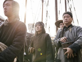 Angela Zhou, centre, and Tzi Ma (right), in a scene from Hell on Wheels.