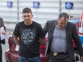 Kevin Rubletz is brought to the Calgary Police Processing Unit in Calgary on Friday, June 26, 2015. Rubletz had been taken into custody during the investigation into the murder of Jessica Rae Newman.