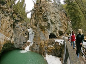 FILE PHOTO: Visitors at the lower falls at Johnston Canyon in Banff National Park during early spring of 2005.