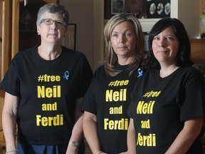Friends and supporters of Neil Bantleman, from the left, former colleagues  from Webber Acadmey Nan McKellar and Jennifer Leong, and Alie Ronellenfitch, until recently a Jakarta resident, gather at McKellar's home Tuesday July 14, 2015. They are spearheading a rally for Bantleman Wednesday at 5 p.m. in the Calgary Municipal Plaza.