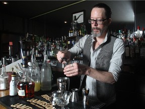 Nathan Head, creates a Champs Elysees cocktail at Milk Tiger Lounge, which was recognized by Conde Nast Traveler as one of the 30 best spots in the world.