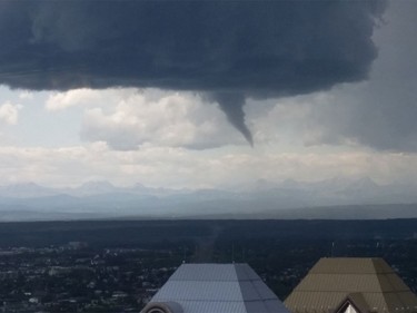 A photo of a funnel cloud captured by Calla Healey from the 54th floor of The Bow building at 12:55 p.m.