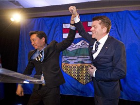 Wildrose MLA Tany Yoa , left, and Alberta Wildrose leader Brian Jean celebrate after being declared the official opposition in Fort McMurray on May 5.