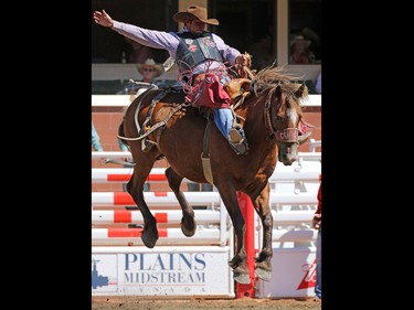 Sam Kelts from Millarville Alberta riding Simons Warrior competes in the saddle bronc event during day 1 of the Calgary Stampede rodeo on  Friday July 3, 2015.