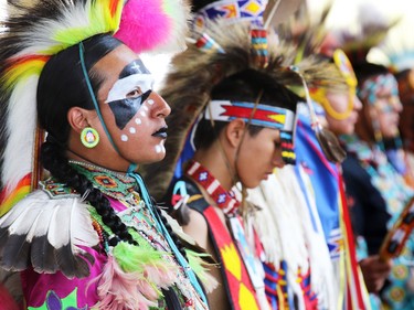 First Nations dancers get ready to perform in a powwow in the Calgary Stampede Indian Village on July 10, 2015.