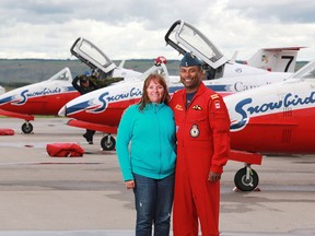 Springbank Airshow organizer Sarah Van Gilst and Snowbird pilot Captain Greg Mendes stand near the the Snowbirds jets after they landed in Springbank on Thursday. Mendes grew up in Calgary.