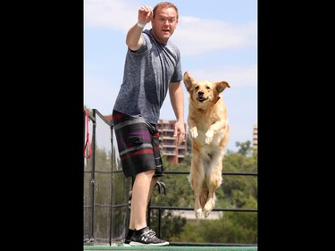 Jeff Boyle throws a toy for his golden retriever Zoe during the Dock Dogs event at Pet-A-Palooza in Eau Claire on Saturday July 25, 2015.
(Gavin Young/Calgary Herald) (For City section story by TBA) Trax# 00067196A