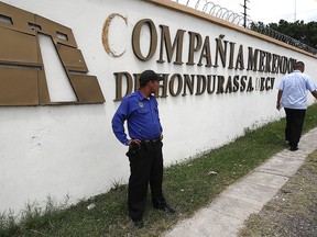 A security guard patrols the front gate of Merendon Mining in Las Casitas, near Tegucigalpa, Honduras on September 24, 2009.
