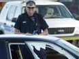 A police officer surveys the scene where FOB gang member Peter Huynh was gunned down in 2005. A war between FOB and the FOB Killers was responsible for at least 25 homicides between 2002 and 2009. Police never were successful in getting the two sides to agree to a truce, but are using the tactic to try to stem recent drug-related gun violence in Calgary.