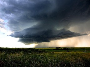 A huge storm cloud forms near Carstairs, Alberta on July 21, 2015.