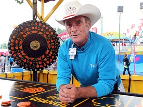 James says business is brisk at the roulette wheel on the midway at the Calgary Stampede.