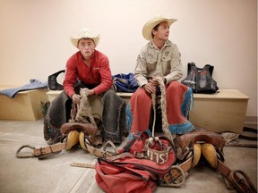 Rusty, 19, left, and his dad Cody Wright are both competing in the saddle bronc competition at the Calgary Stampede.