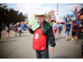 Erwin Exner, 77, has come to the Calgary Stampede 12 times by Greyhound from Sudbury, Ont. He's a volunteer with the Kinsmen Club of Calgary's annual Wheels Lottery. He's seen here at the Stampede grounds on July 7, 2015.