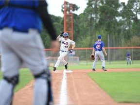 Calgary musician J.R. Shore rounds third during a fantasy baseball camp earlier this year. This weekend he's sing Take Me Out to the Ball Game during a Mets game on Sunday.