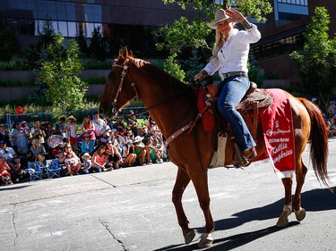 Parade marshal and Olympic medalist Kaillie Humphries waves during the Calgary Stampede parade in Calgary, Friday, July 3.