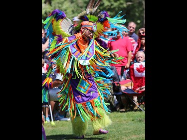 Blake Yellowhorn, a First Nations dancer, performs during a powwow on Prince's Island on Canada Day 2015.