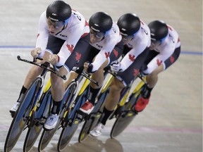 Canada's Allison Beveridge, Laura Brown, Jasmin Glaesser and Kirsti Lay pedals during the women's team pursuit track cycling competition at the Pan Am Games in Milton, Ontario, Thursday, July 16, 2015.