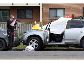 Calgary Police investigate a shooting that sent one man to hospital with critical injuries, and left one man dead in Calgary's N.E. along Rundlehorn Drive on July 11, 2015.