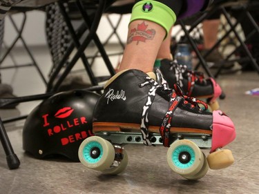 Christina Ryan/ Calgary Herald CALGARY, Alberta --JULY 1, 2015 -- A roller derby skater shows off her quad skates during the Calgary Roller Derby Association's May long weekend bootcamp. All roller derby skaters wear the four-wheeled skates to play sport; inline skates are not allowed, on July 16, 2015. (Christina Ryan/Calgary Herald) (For {sup 1} story by {cart}) 00066623A SLUG: 9999 Roller Derby 1