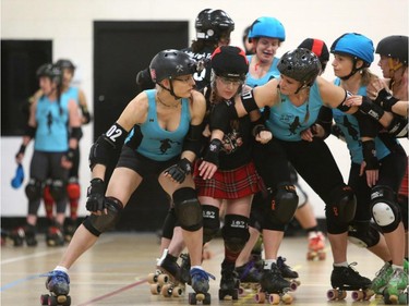 Christina Ryan/ Calgary Herald CALGARY, Alberta --JULY 29, 2015 -- Blockers from both teams are in fine form as they block the jammers trying to get out of the pack and score points during a Calgary Roller Derby Association scrimmage, on July 16, 2015. (Christina Ryan/Calgary Herald) (For {sup 1} story by {cart}) 00066623A SLUG: 9999 Roller Derby 9