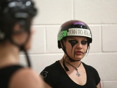 Christina Ryan/ Calgary Herald CALGARY, Alberta --JULY 29, 2015 -- Thrashin Lassies skater Farren Fouls listens to her captain talk strategy during a timeout in a Calgary Roller Derby Association scrimmage, on July 16, 2015. (Christina Ryan/Calgary Herald) (For {sup 1} story by {cart}) 00066623A SLUG: 9999 Roller Derby 11