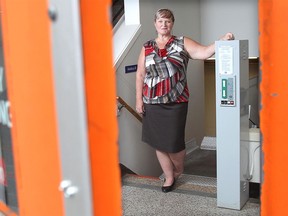 Luanne Whitmarsh, CEO of the Kerby Centre, shows a lift at the 55-plus facility Friday. The centre has other ramps that are in need of upgrading and is in favour of a review of accessibility in civic facilities.