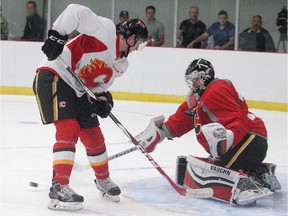 Goalie Jon Gillies turns aside a shot by Ryan Culkin during the Calgary Flames' prospect camp scrimmage on Thursday.