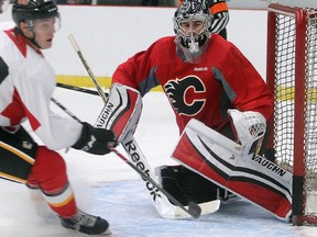 Goalie hopeful Jon Gillies turns aside a shot during the Calgary Flames prospect camp scrimmage Thursday July 10, 2015 at Winsport.